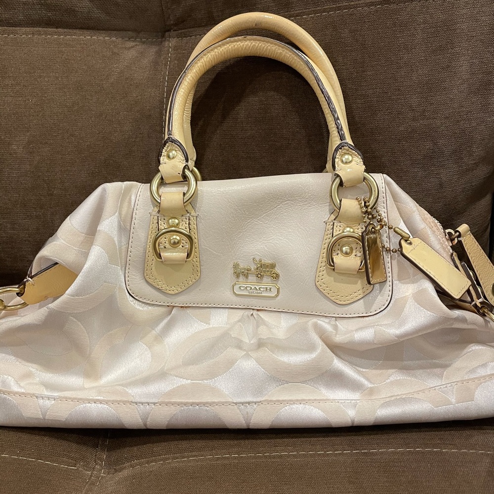 White Coach bag with a strap